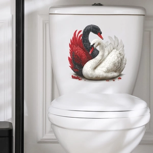 Elegant black and white swan decal applied to a white ceramic toilet tank in a bathroom