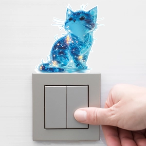 Luminous star cat wall decal placed above a modern light switch on a minimalist white wall