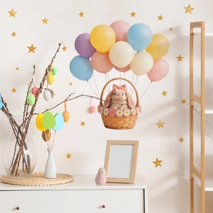 Cartoon bunny in hot air balloon wall decal with colorful balloons and gold stars