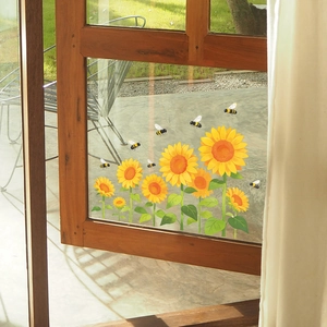 Sunflower and bee window stickers on a wooden glass pane with garden background