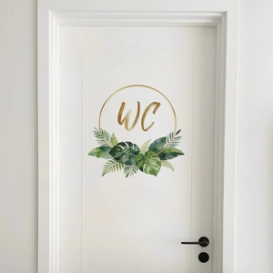 Creative WC door sticker with gold lettering and tropical green leaves on white wood door