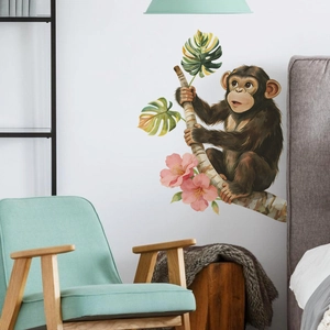 Cute monkey and branch wall decal in a modern living room setting for home decor