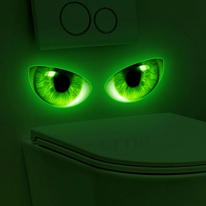 Glow-in-the-dark green cat eyes luminous wall stickers for home and bathroom decoration