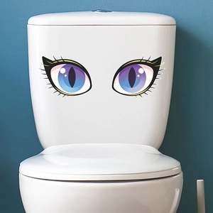 Luminous blue eye wall stickers for bedroom and living room decor on a white surface
