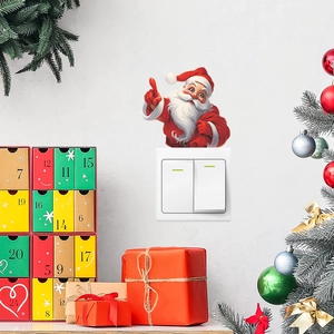 Adesivo per interruttore a tema Babbo Natale con decorazioni festive su parete bianca