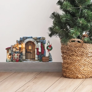 Christmas fairy door wall decor with stone cottage design and miniature holiday ornaments
