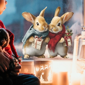 Stickers de fenêtre de Noël avec deux lapins mignons et cadeaux dans un décor festif