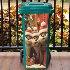 Christmas beaver window stickers on a green outdoor trash can with festive decorations