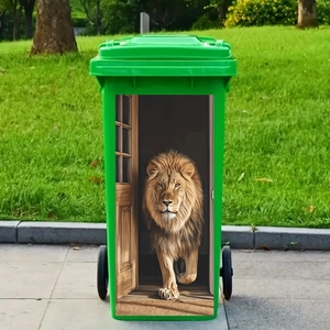 Green outdoor trash bin with two wheels and a creative 3D lion door decal on the front