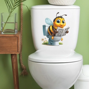 Cartoon bee reading newspaper toilet sticker on white ceramic tank for home decor