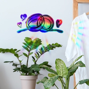 Rainbow prism window decal detail with minimalist hand-drawn heart and ring outlines