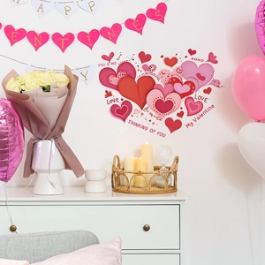 Romantic Valentine heart wall stickers with LOVE phrases on a white bedroom wall