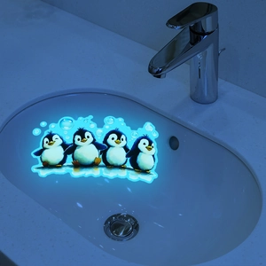 Luminous cartoon penguin wall stickers for bathroom sink glowing in dark blue environment