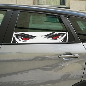 Cartoon anime frowning red eyes car window sticker on a grey vehicle side window