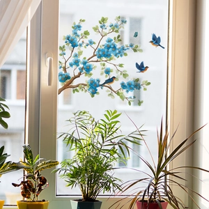 Blue flower branches and flying birds wall sticker on window glass with green plants