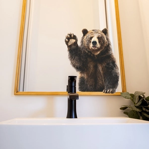 Self-adhesive 3D brown bear wall sticker decorating a bathroom mirror for a cute home aesthetic