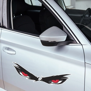Fierce red-eyed devil anime car sticker on silver vehicle door for wall and auto decor