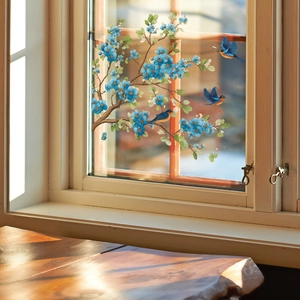 Blue bird and flower branch wall decal on glass window in a cozy home setting