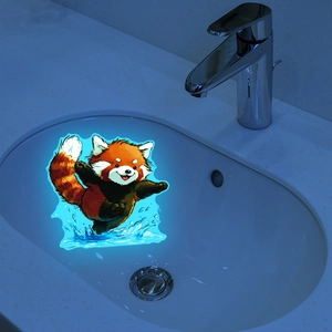 Luminous red panda wall sticker with glowing blue water splashes on a white ceramic surface