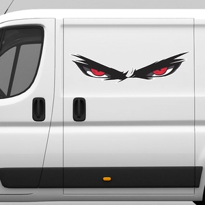 Fierce red demon eyes vinyl car sticker applied on a white van side door surface