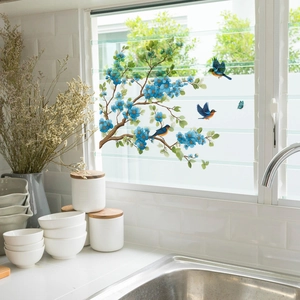 Self-adhesive wall sticker featuring blue flowers, branches, and birds for home decor