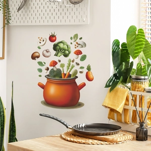 Vibrant kitchen wall sticker with orange cooking pot and floating fresh vegetables