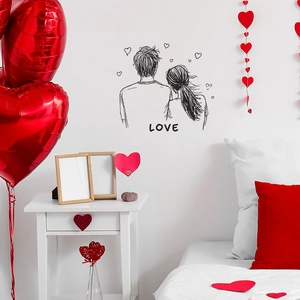Romantic black couple wall decal with hand-drawn hearts and LOVE text for bedroom decor