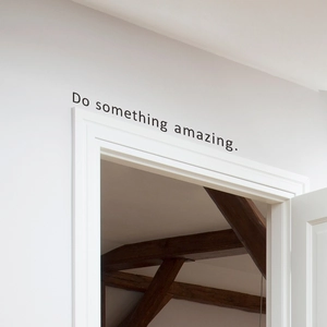 Minimalist 'Do something amazing' wall decal in matte black for home interior decor