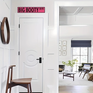 Pink decorative door sign with black Big Booty Blvd text for modern home wall decor