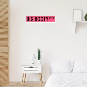 Modern pink street sign wall decor featuring Big Booty Blvd text for bedroom styling