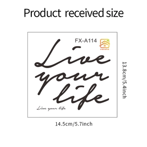 Detail showing 'Live your life' wall sticker lettering in elegant black script style