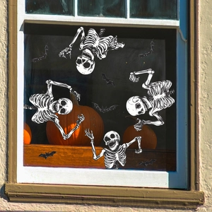 Halloween window stickers featuring skeletons and bats decorations for glass display