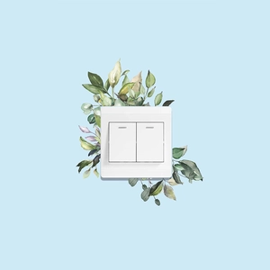 Minimalist white double wall light switch with green plant leaves mural decoration