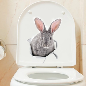 Sticker mural 3D lapin gris réaliste avec effet papier déchiré sur toilettes blanches