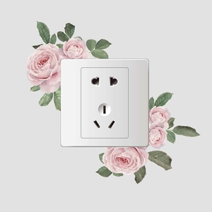 Detail view of modern white wall socket with elegant pink rose floral wall decals