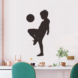 Soccer boy silhouette wall decal for kids room decoration on a clean white interior wall