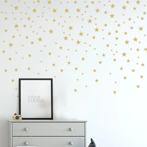 Set of gold star wall stickers in various sizes for minimalist nursery wall decor