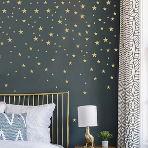 Minimalist gold star wall stickers set for kids bedroom decor with various star sizes