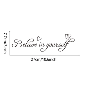 Close-up detail of 'Believe in yourself' wall sticker with heart accents and dimensions