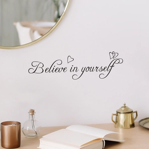 Inspirational 'Believe in yourself' vinyl wall decal with heart accents on white wall