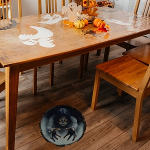 3D Halloween floor decal featuring a spooky ghost girl emerging from a dark hole
