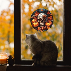 Halloween window sticker featuring skull with pumpkins and autumn leaves on glass