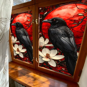 Gothic style window film with black ravens and red moon on a wooden frame window