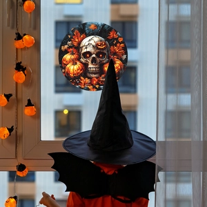 Halloween window sticker featuring skull and pumpkins with maple leaves decoration