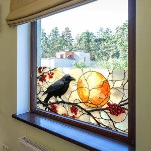 Stained glass style window film featuring a black crow on a branch with an orange moon