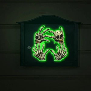 Luminous Halloween wall stickers featuring green glowing skulls and skeletal hands