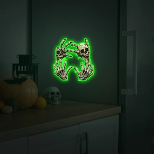 Luminous Halloween skull and skeleton hand wall sticker with neon green glowing effect