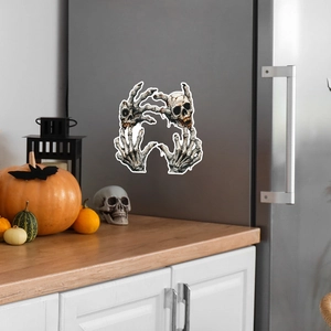 Gothic Halloween glow-in-the-dark skull hand wall decals on a metallic fridge surface