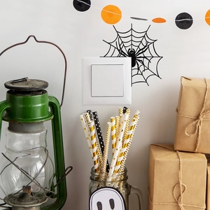 Halloween spider web and spider wall stickers on a square white light switch panel