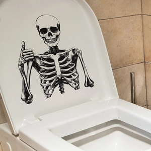 Halloween toilet sticker featuring a creative smiling skeleton giving a thumbs up gesture